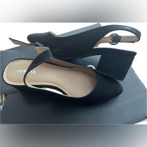 Torrid black short heel with strap, never worn.
